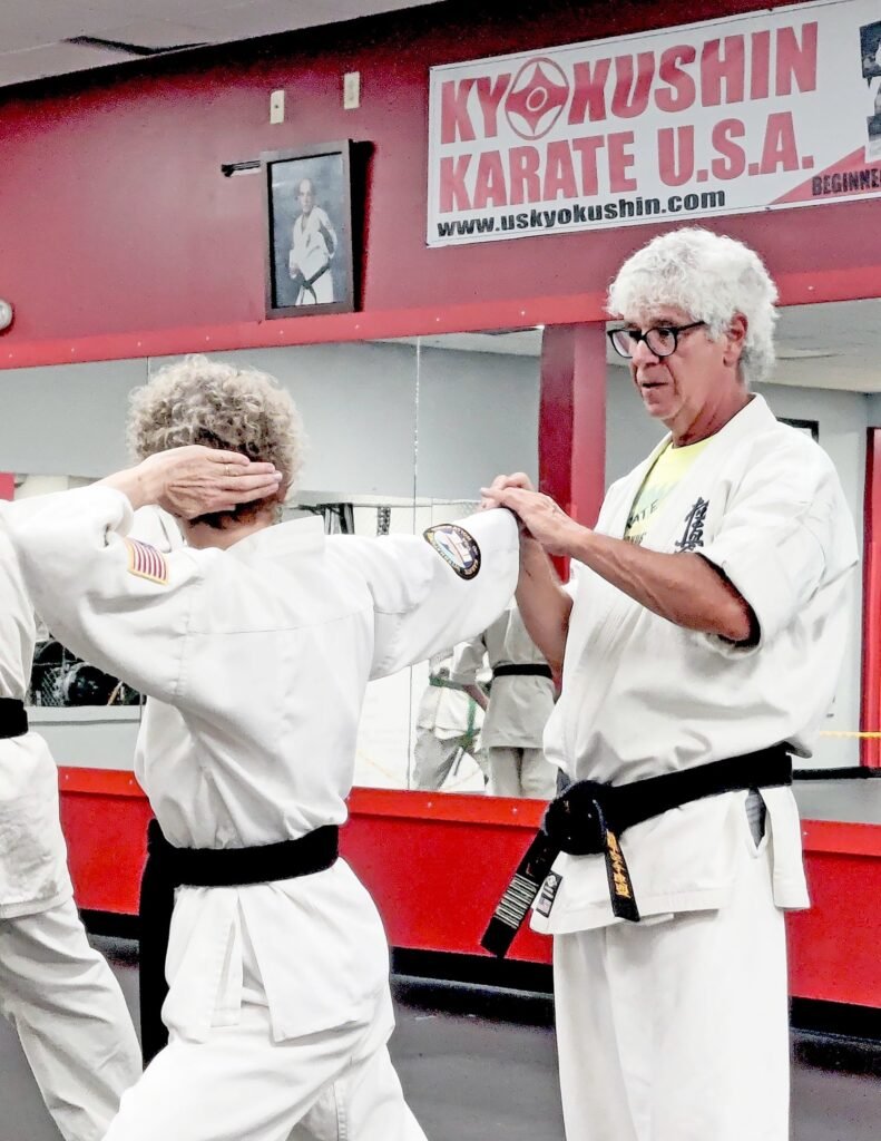 Shihan Michael Monaco working with Sensei Lisa Cook at Kyokushin Karate USA in Rochester, New York